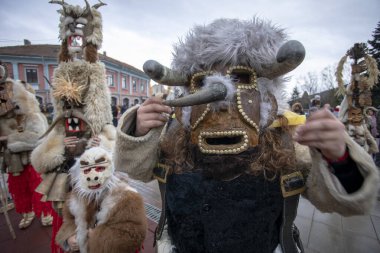 Breznik, Bulgaria - January 21, 2023: Masquerade festival in Breznik Bulgaria. People with a mask called Kukeri dance and perform to scare the evil spirits. The photo was taken on January 21th, 2023