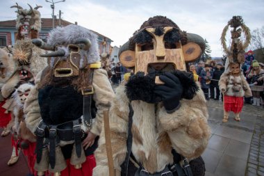 Breznik, Bulgaria - January 21, 2023: Masquerade festival in Breznik Bulgaria. People with a mask called Kukeri dance and perform to scare the evil spirits. The photo was taken on January 21th, 2023