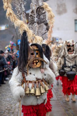Breznik, Bulgaria - January 21, 2023: Masquerade festival in Breznik Bulgaria. People with a mask called Kukeri dance and perform to scare the evil spirits. The photo was taken on January 21th, 2023