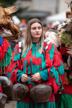 Breznik, Bulgaria - January 21, 2023: Masquerade festival in Breznik Bulgaria. People with a mask called Kukeri dance and perform to scare the evil spirits. The photo was taken on January 21th, 2023