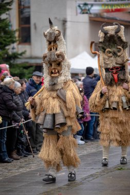 Breznik, Bulgaria - January 21, 2023: Masquerade festival in Breznik Bulgaria. People with a mask called Kukeri dance and perform to scare the evil spirits. The photo was taken on January 21th, 2023