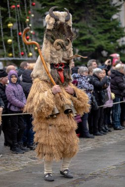 Breznik, Bulgaria - January 21, 2023: Masquerade festival in Breznik Bulgaria. People with a mask called Kukeri dance and perform to scare the evil spirits. The photo was taken on January 21th, 2023