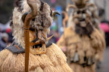 Breznik, Bulgaria - January 21, 2023: Masquerade festival in Breznik Bulgaria. People with a mask called Kukeri dance and perform to scare the evil spirits. The photo was taken on January 21th, 2023