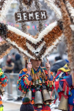 Pernik, Bulgaria - January 28, 2023: Masquerade festival in Pernik Bulgaria. People with a mask called Kukeri dance and perform to scare the evil spirits. The photo was taken on January 28th, 2023