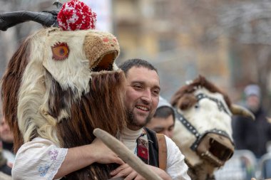 Pernik, Bulgaria - January 28, 2023: Masquerade festival in Pernik Bulgaria. People with a mask called Kukeri dance and perform to scare the evil spirits. The photo was taken on January 28th, 2023