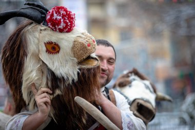Pernik, Bulgaria - January 28, 2023: Masquerade festival in Pernik Bulgaria. People with a mask called Kukeri dance and perform to scare the evil spirits. The photo was taken on January 28th, 2023
