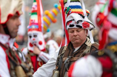 Pernik, Bulgaria - January 28, 2023: Masquerade festival in Pernik Bulgaria. People with a mask called Kukeri dance and perform to scare the evil spirits. The photo was taken on January 28th, 2023