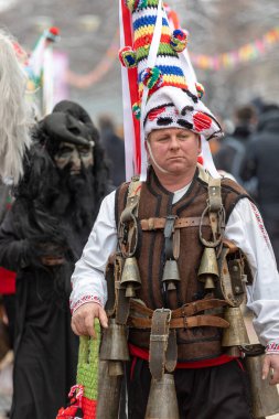 Pernik, Bulgaria - January 28, 2023: Masquerade festival in Pernik Bulgaria. People with a mask called Kukeri dance and perform to scare the evil spirits. The photo was taken on January 28th, 2023