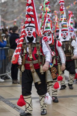 Pernik, Bulgaria - January 28, 2023: Masquerade festival in Pernik Bulgaria. People with a mask called Kukeri dance and perform to scare the evil spirits. The photo was taken on January 28th, 2023