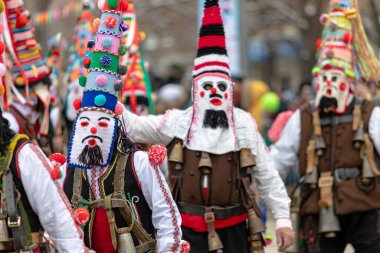 Pernik, Bulgaria - January 28, 2023: Masquerade festival in Pernik Bulgaria. People with a mask called Kukeri dance and perform to scare the evil spirits. The photo was taken on January 28th, 2023