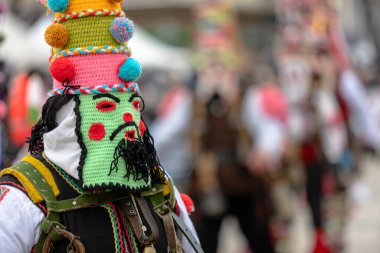 Pernik, Bulgaria - January 28, 2023: Masquerade festival in Pernik Bulgaria. People with a mask called Kukeri dance and perform to scare the evil spirits. The photo was taken on January 28th, 2023