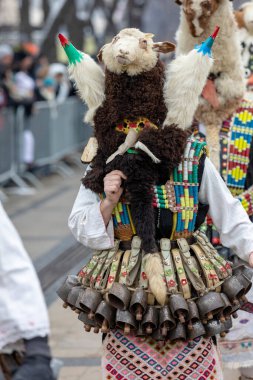 Pernik, Bulgaria - January 28, 2023: Masquerade festival in Pernik Bulgaria. People with a mask called Kukeri dance and perform to scare the evil spirits. The photo was taken on January 28th, 2023