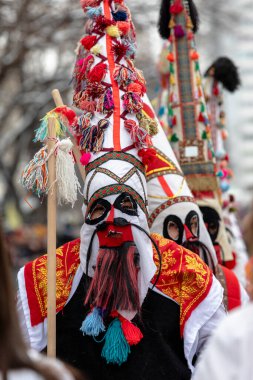 Pernik, Bulgaria - January 28, 2023: Masquerade festival in Pernik Bulgaria. People with a mask called Kukeri dance and perform to scare the evil spirits. The photo was taken on January 28th, 2023