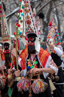 Pernik, Bulgaria - January 28, 2023: Masquerade festival in Pernik Bulgaria. People with a mask called Kukeri dance and perform to scare the evil spirits. The photo was taken on January 28th, 2023