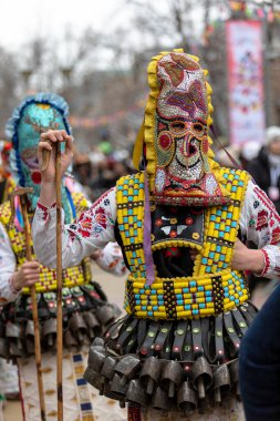 Pernik, Bulgaria - January 28, 2023: Masquerade festival in Pernik Bulgaria. People with a mask called Kukeri dance and perform to scare the evil spirits. The photo was taken on January 28th, 2023