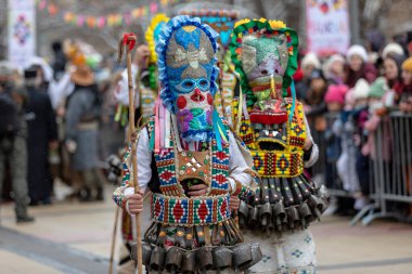 Pernik, Bulgaria - January 28, 2023: Masquerade festival in Pernik Bulgaria. People with a mask called Kukeri dance and perform to scare the evil spirits. The photo was taken on January 28th, 2023