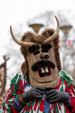 Pernik, Bulgaria - January 28, 2023: Masquerade festival in Pernik Bulgaria. People with a mask called Kukeri dance and perform to scare the evil spirits. The photo was taken on January 28th, 2023