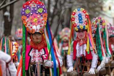 Pernik, Bulgaria - January 28, 2023: Masquerade festival in Pernik Bulgaria. People with a mask called Kukeri dance and perform to scare the evil spirits. The photo was taken on January 28th, 2023