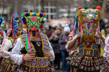 Pernik, Bulgaria - January 28, 2023: Masquerade festival in Pernik Bulgaria. People with a mask called Kukeri dance and perform to scare the evil spirits. The photo was taken on January 28th, 2023