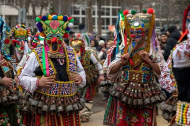 Pernik, Bulgaria - January 28, 2023: Masquerade festival in Pernik Bulgaria. People with a mask called Kukeri dance and perform to scare the evil spirits. The photo was taken on January 28th, 2023