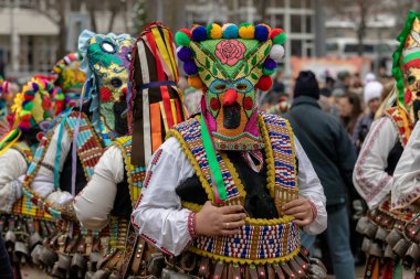 Pernik, Bulgaria - January 28, 2023: Masquerade festival in Pernik Bulgaria. People with a mask called Kukeri dance and perform to scare the evil spirits. The photo was taken on January 28th, 2023