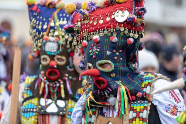Pernik, Bulgaria - January 28, 2023: Masquerade festival in Pernik Bulgaria. People with a mask called Kukeri dance and perform to scare the evil spirits. The photo was taken on January 28th, 2023