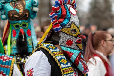 Pernik, Bulgaria - January 28, 2023: Masquerade festival in Pernik Bulgaria. People with a mask called Kukeri dance and perform to scare the evil spirits. The photo was taken on January 28th, 2023