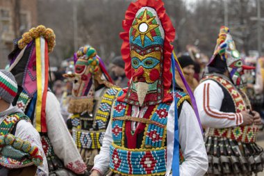 Pernik, Bulgaria - January 28, 2023: Masquerade festival in Pernik Bulgaria. People with a mask called Kukeri dance and perform to scare the evil spirits. The photo was taken on January 28th, 2023