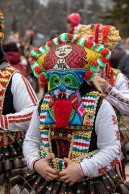 Pernik, Bulgaria - January 28, 2023: Masquerade festival in Pernik Bulgaria. People with a mask called Kukeri dance and perform to scare the evil spirits. The photo was taken on January 28th, 2023