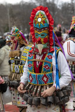 Pernik, Bulgaria - January 28, 2023: Masquerade festival in Pernik Bulgaria. People with a mask called Kukeri dance and perform to scare the evil spirits. The photo was taken on January 28th, 2023
