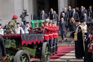 Sofia, Bulgaria, 16 March, 2024: Guards carry the coffin of the late Bulgarian Patriarch and Sofia Metropolitan Neophyte during the funeral service. clipart