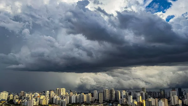 Beautiful view of a dramatic dark stormy sky. The rain is coming soon. The pattern of the clouds over the city. Very heavy rain sky in Sao Paulo city, Brazil, South America.