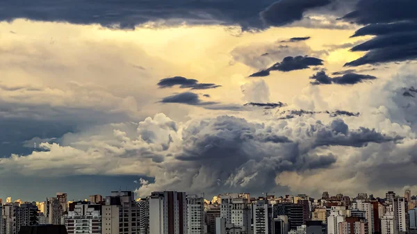 Beautiful view of a dramatic dark stormy sky. The rain is coming soon. The pattern of the clouds over the city. Very heavy rain sky in Sao Paulo city, Brazil, South America.