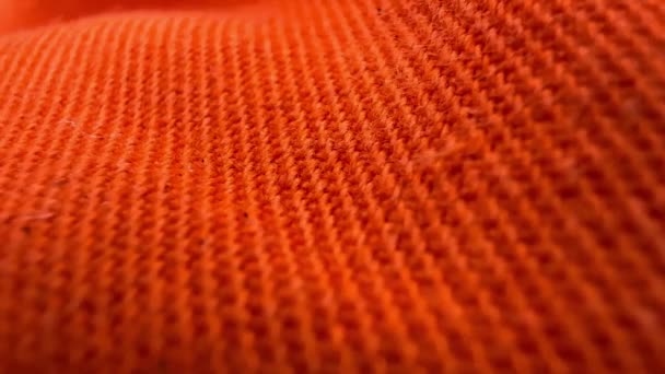 Close Pano Tecido Textura Laranja Fundo Têxtil Movimento Esquerda Para — Vídeo de Stock