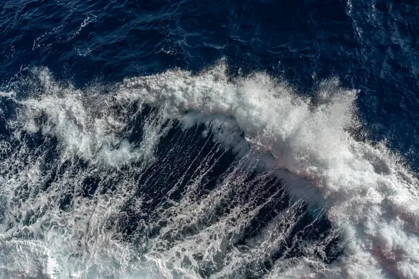 stock image Top view of ocean waves. Blue water background.