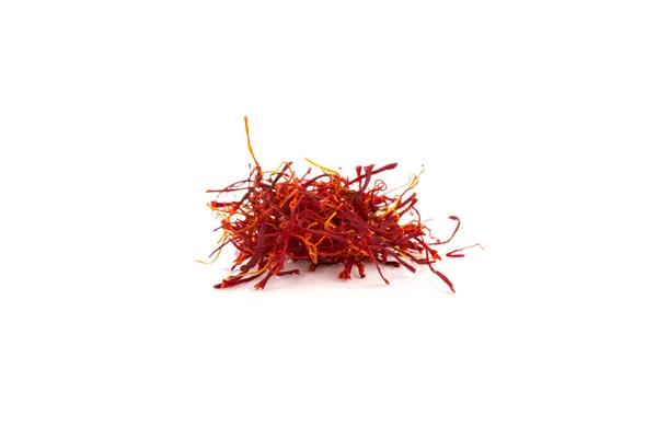 Dried saffron spice pieces isolated on a white background