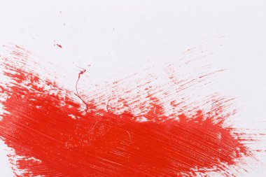 Red stroke splash of the paint brush on white paper