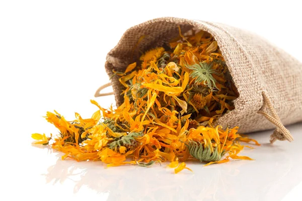 stock image Calendula flowewr tea for infusion in sack on white background