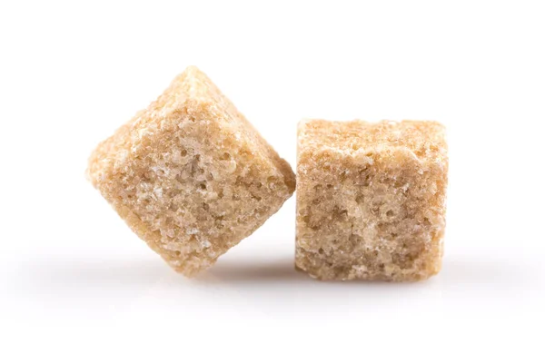 Beyaz Bir Arka Plan Üzerinde Izole Kahverengi Şeker Cubes — Stok fotoğraf