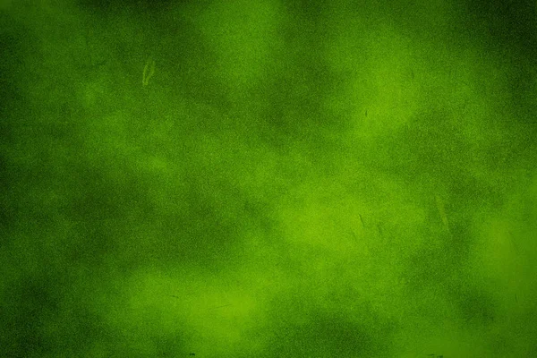 緑のテクスチャの背景に明るいセンター スポット ライト — ストック写真