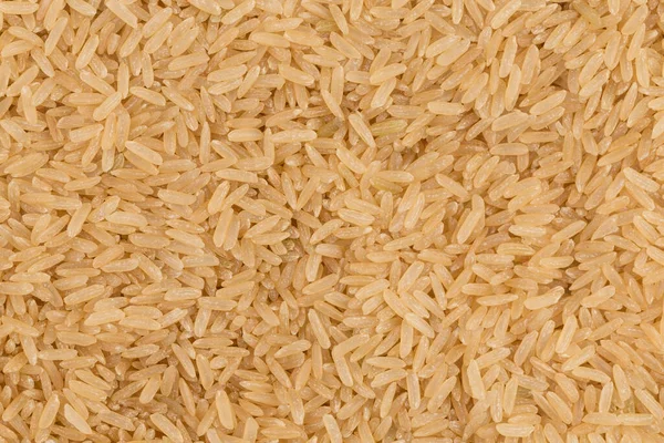Pişmemiş Kahverengi Pirinç Arka Plan Görüntüsü Kapatmak — Stok fotoğraf