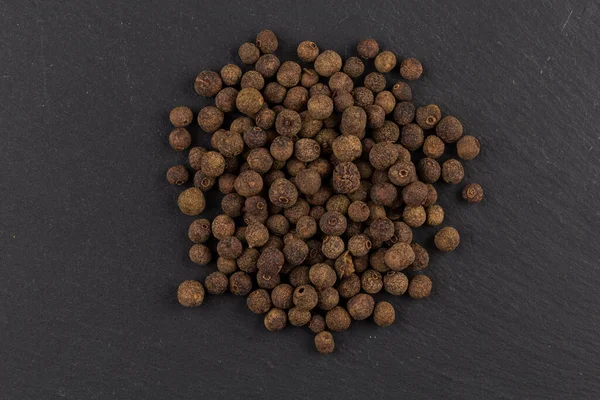 Large Black Peppercorn Seeds Dark Stone Background — Stock Photo, Image