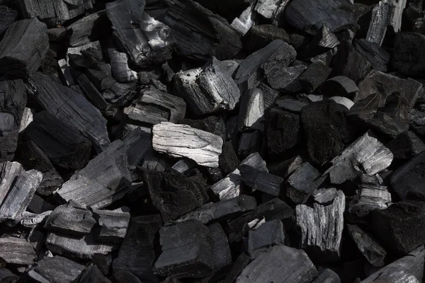 Coal mineral black as a cube stone background