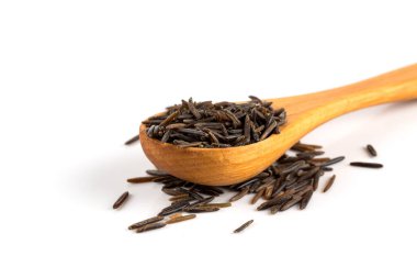 Close-up of wild brown, black rice on white background