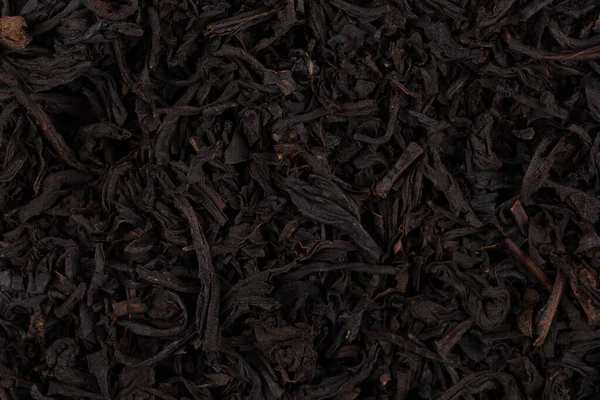 Ξηρό Μαύρο Τσάι Φύλλα Στενή Επάνω Της Υφής Για Φόντο — Φωτογραφία Αρχείου