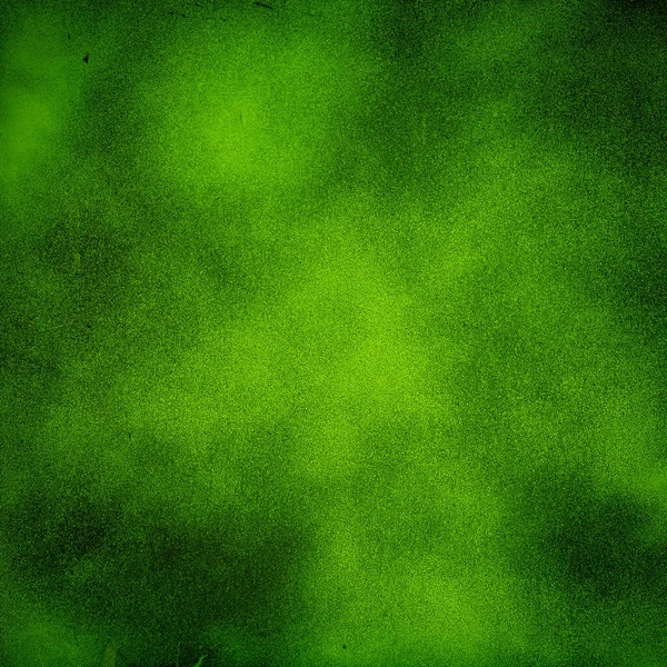 スポット ライト明るいセンターと緑の濃いテクスチャ背景 — ストック写真