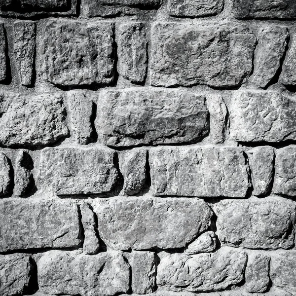 ビンテージの石の壁と砂床のテクスチャの背景 — ストック写真