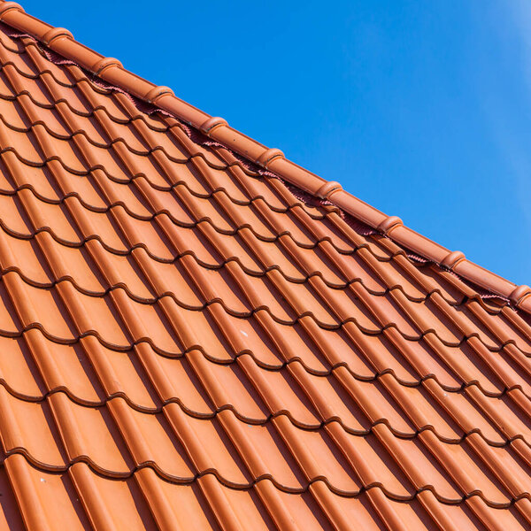 roof tile pattern, close up. Over blue sky
