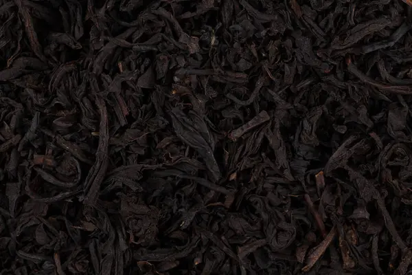 Ξηρό Μαύρο Τσάι Φύλλα Στενή Επάνω Της Υφής Για Φόντο — Φωτογραφία Αρχείου