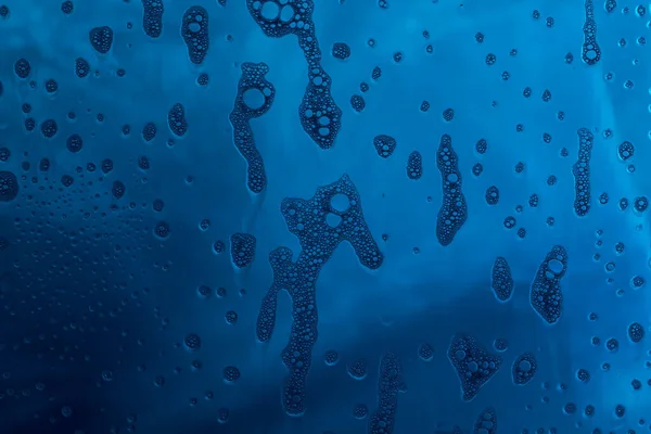 stock image Blue texture with natural soap foam pattern on glass